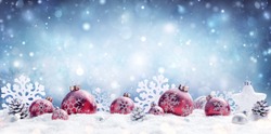 Christmas - Red Baubles Decorated And Snowflakes In Snowing Background 
