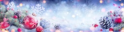 Christmas Decoration Banner - Snowy Ornament With Pinecones On Fir Branch And Defocused Lights

