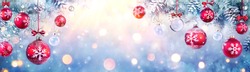 Christmas Balls Hanging Fir Branches With Lights In Abstract Defocused Background