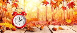 Fall Back Time - Daylight Savings End - Clock Alarm And Leaves In Falling Background - Return To Winter Time