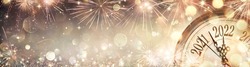 2022 New Year - Golden Clock With Fireworks And Defocused Abstract Lights
