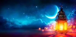 Ramadan Kareem - Moon And Arabian Lantern With Blue Sky At Night With Abstract Defocused Lights - Eid Ul Fitr