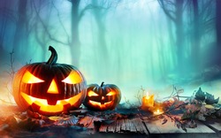 Pumpkins Burning In Forest At Night - Halloween Background