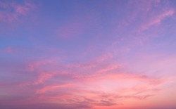 Abstract nature background.Moody pink, purple clouds sun set sky with long shutter