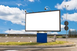 Blank billboard in a parking on a sunny day with clipping path