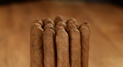 Cuban cigars tobacco in group closed up low key background
