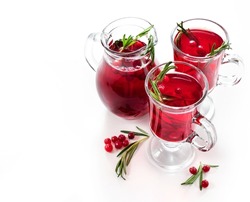 Cranberry tea or refreshing cocktail with cranberry and rosemary isolated on white background. Top view.