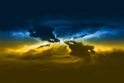 Massive clouds with thunder and lightning discharges of yellow-blue color.
