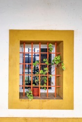 Colorful window in the facade of a typical Portuguese house at Porto, Portugal.