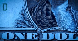 Front side of one dollar paper bill with part portrait of first President George Washington. American dollars banknote in macro shot. American currency, greenback, cash. Money background in blue tint.