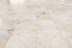 Real marble floor tile pattern new and clean condition for background, Symmetry grid line and space of marble texture in perspective view, Home interior decor with marble floor tile pattern luxury.