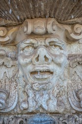 Ancient sculpture of funny, tricky and joyful dickens at fountains in historical downtown of Dresden, Germany, details, closeup. Concept of art and historical heritage