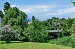 Spring panorama of part of residential area with lake and bridge, Drujba, Sofia, Bulgaria  