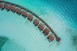 Luxury overwater villas from above. Aerial drone picture. Crossroads Maldives, saii lagoon hotel. July 2021