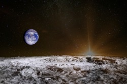 Sunrise above the moon surface. Blue Earth in the space. Elements of this image furnished by NASA.