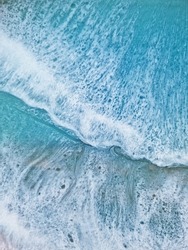 Aerial view of sea foamy waves, blue ocean water, seaside epoxy resin minimalist art