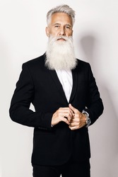 Handsome aged man wearing stylish black suit on white background