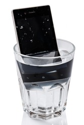 Smartphone in glass with water on white background