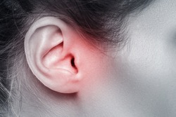 Close up of female ear with source of pain