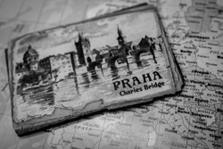 Souvenir from Prague magnet on the map of Europe travel background