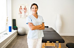 A Portrait of a physiotherapy woman smiling in uniforme