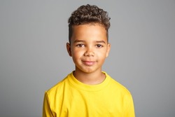 Adorable african boy on studio white background