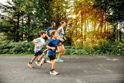 A Family exercising and jogging together at an outdoor park