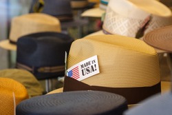 Hats in store window with Made in USA tag