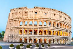 Colosseum, or Coliseum. Illuminated huge Roman amphitheatre early in the morning, Rome, Italy.