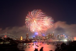 Sydney new year fireworks over CBD Harbour bridge color flash ball
