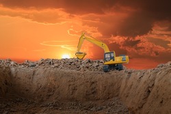 Crawler Excavators are digging the soil in the construction site on  sunset background