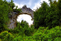 Arch Rock is a seastack carved from centuries of wind and water erosion from the Great Lakes  It is the most famous natural landmark on Mackinaw Island, Michigan.  