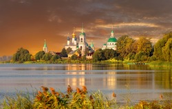 View of Spaso-Yakovlevsky Monastery in Rostov Veliky from Nero's lake on a sunset