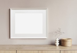 Horizontal picture frame mockup on a wall. Artwork template in interior design.