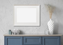 Horizontal picture frame mockup on a wall. Artwork template in interior design.