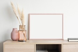 Blank picture frame mockup on white wall. Artwork template in interior design