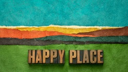 happy place - word abstract in vintage lettepress wood type against abstract paper landscape, joy and happiness concept - a memory, situation, or activity that makes you feel happy
