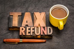 tax refund  banner - word abstract in vintage letterpress printing blocks against textured paper with a cup of coffee, business financial concept