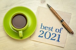 best of 2021 -  handwriting on a napkin with a cup of coffee, product or business review of the recent year