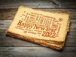 Happy New Year 2022 greetings card  - word cloud on a retro handmade paper