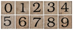 a set of isolated 10 numbers from zero to nine - rough black painting on a grunge wooden blocks