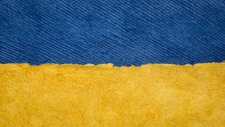 paper abstract in colors of Ukrainian national flag - blue and yellow, set of textured, handmade, bark paper sheets