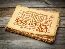 Happy New Year 2023 greetings card  - word cloud on a retro handmade paper