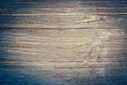 closeup of grunge and gritty blue painted, rough wood background