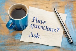 Have questions? Ask. Handwriting on a napkin with a cup of espresso coffee