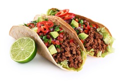 Mexican tacos with beef, tomatoes, avocado, chilli and onions isolated on white background. With clipping path.