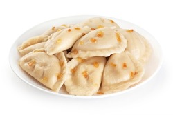 Dumplings with fried onions isolated on white background. Varenyky, vareniki, pierogi, pyrohy with filling. With clipping path.