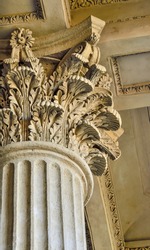 Column capital close up - architectural element of antique buildings decoration. Upper view of stone column decor - curved leaves. Detaile of Kazan Cathedral in St. Petersburg