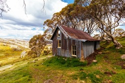 Landscape scenery and Cope Hut on Wallaces Heritage Trail on a hot summer's day near Falls Creek in the Victorian Alps, Australia