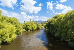 Landscape during summer around the Kiewa River at Keegans Bridge and Streamside Reserve in the Ovens Valley near Mt Beauty in Victoria, Australia.
